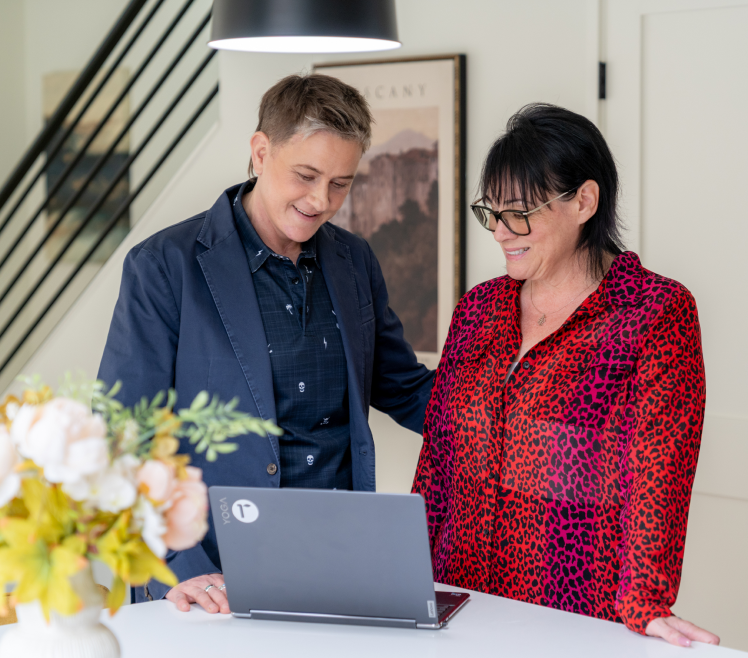 Two people reviewing documents